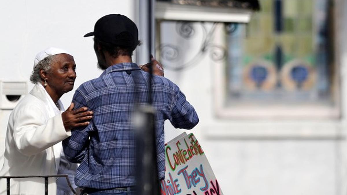 
Mourners gather outside the wake of Walter Scott Friday, April 10, 2015, in Charleston, S.C. Scott was killed by a North Charleston police officer Saturday after a traffic stop in North Charleston, S.C. The officer, Michael Thomas Slager, has been fired and charged with murder.
