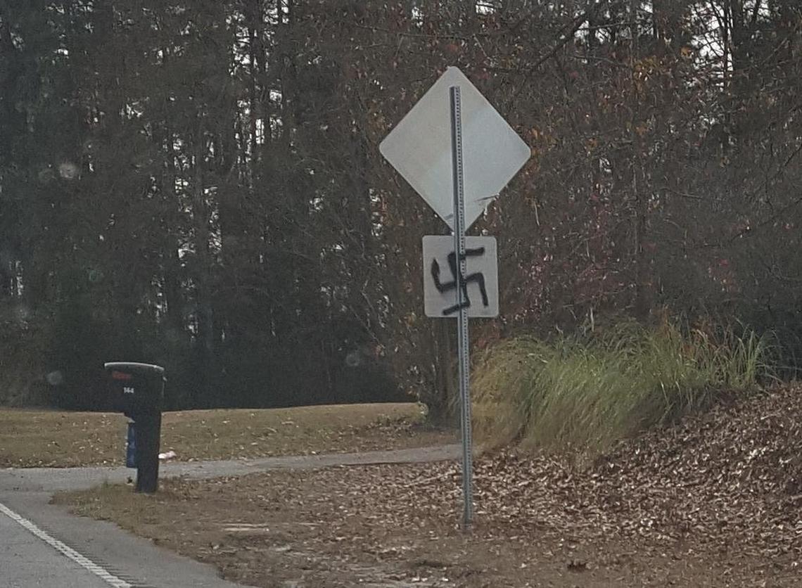 Graffiti of a Swastika on the back of a road sign in Lexington County.