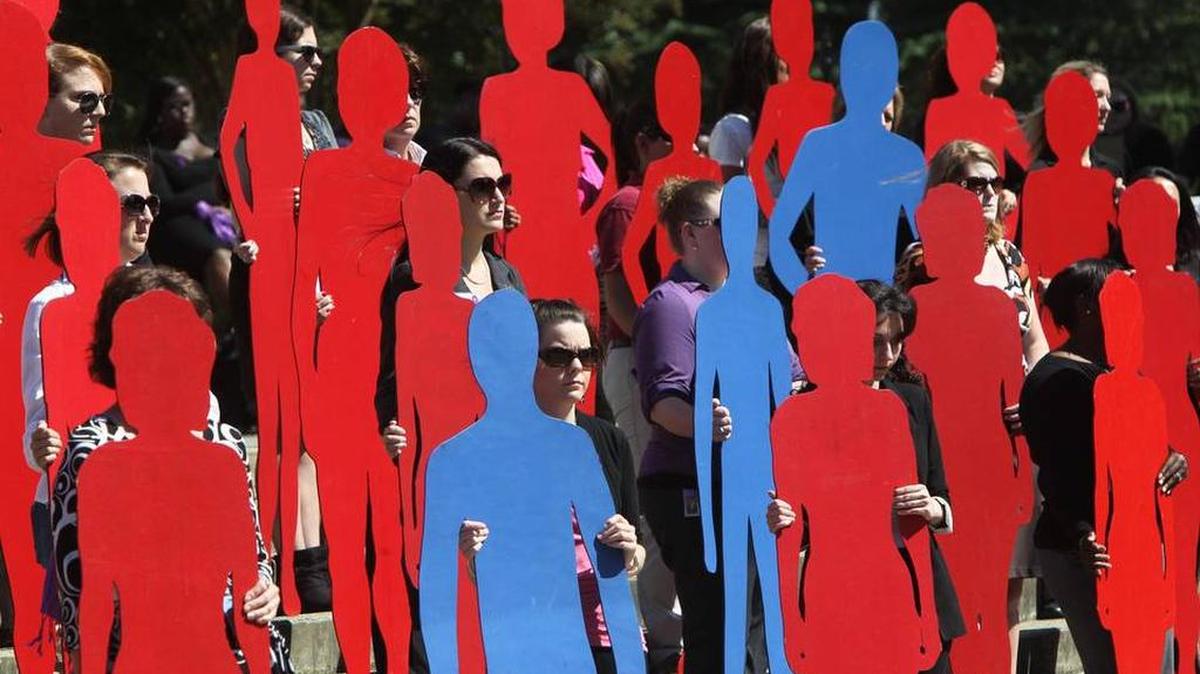 
Victims of domestic violence in South Carolina are represented with silhouettes during the annual Silent Witness program at the Statehouse
