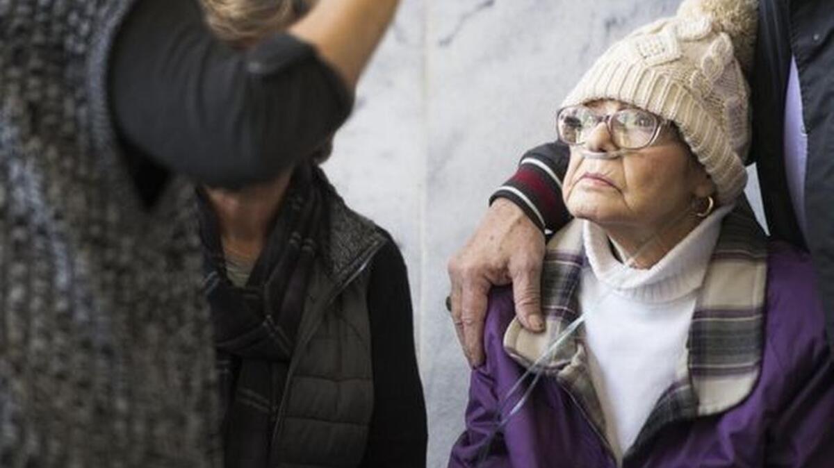 Regina Tague, mother of Todd Kohlhepp, speaks with family members of Superbike Motorsports victims outside of the courtroom before a hearing for a lawsuit filed by Kayla Brown against Kohlhepp at Spartanburg County Courthouse on Thursday, January 5, 2017.
