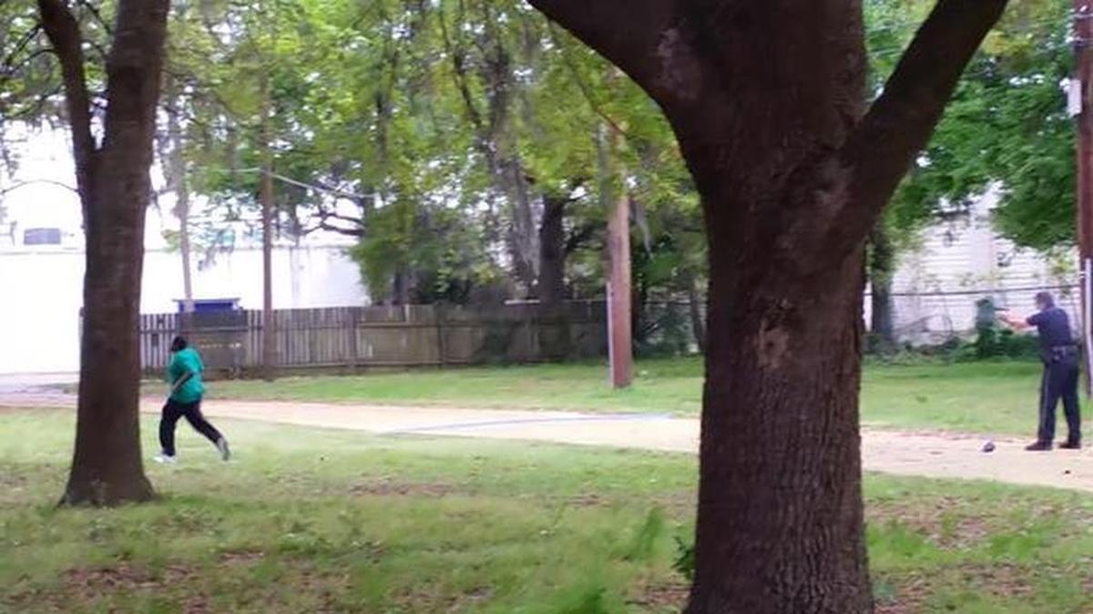 A screen shot from a bystander’s video showing the shooting of Walter Scott