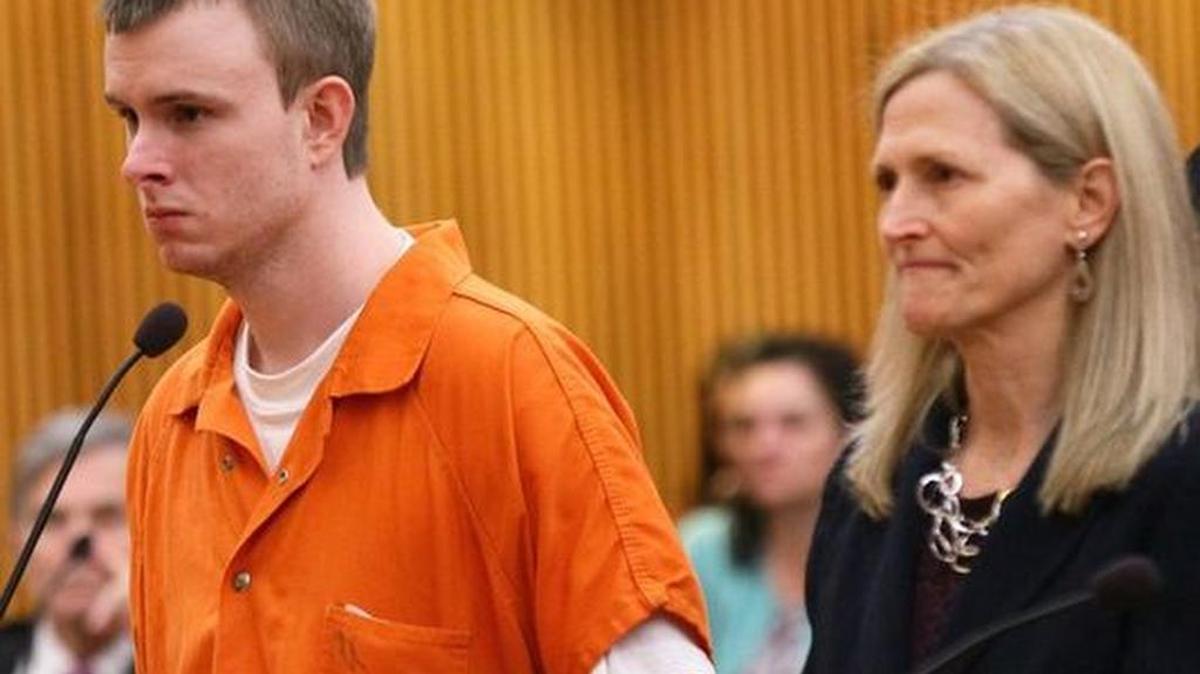 Riley McDermott, left, a former Anderson University assistant baseball coach, stands with attorney Druanne White as he listens to a judge sentence him to 18 years.