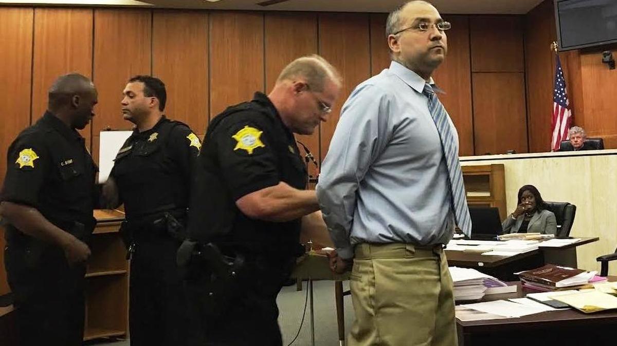 A Richland County deputy uncuffs Nathan Martinez on Tuesday before Martinez acts as his own attorney and questions a woman he is accused of sexually assaulting.