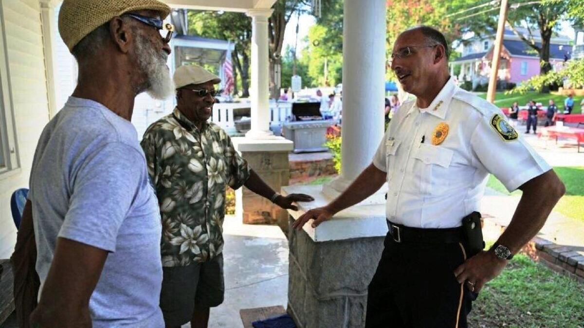 Columbia police chief Skip Holbrook, shown talking to Arsenal Hill residents, seeking more officers to patrol the growing Bull Street neighborhood.