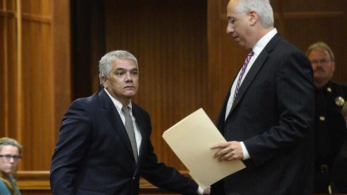 Damon Mallatere, the former manager of the Best Western in Boone, on left, leaves the courtroom after he pleads guilty during a plea agreement, his lawyer David Freedman on right.