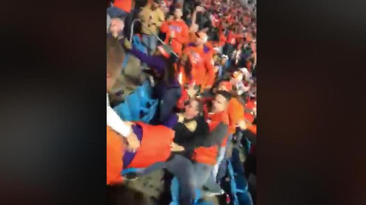 Police have charged a man with assault in connection with a bloody fight during the Clemson-Miami game on Dec. 2, 2017. The fight was captured on video and posted on Facebook.