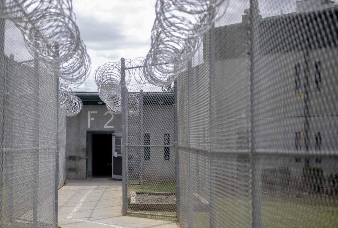 Barbed wired fencing guides a path to a Kirkland Correctional Institution dorm Thursday March 14, 2019, in Columbia, SC.