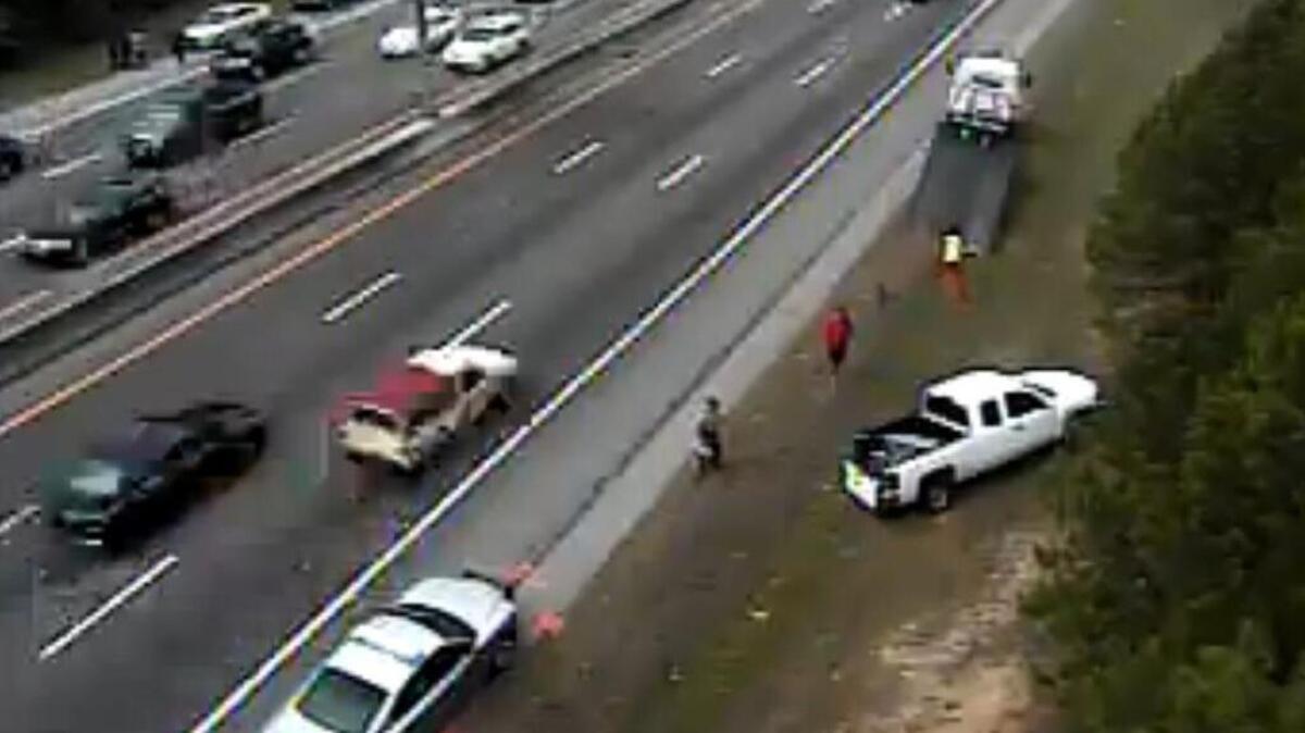 Troopers say a truck fled after striking a passenger car on I-26 westbound Sunday morning. The car belonging to a driver who stopped on the westbound side to help was struck by another car.
