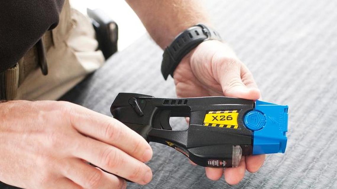 A trainer at U.S. Customs and Border Protection's Advanced Training Center holds a model X26 Taser.