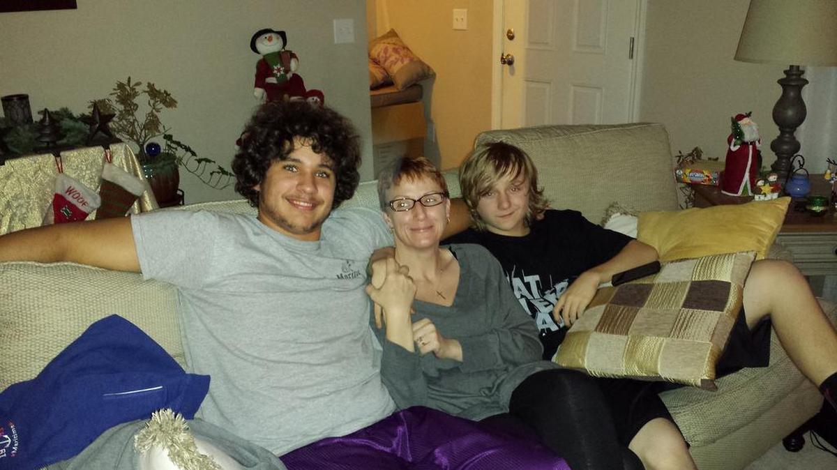 William Thompson, left, moved in with Colleen Reedy, center, and her son Griffin in October.