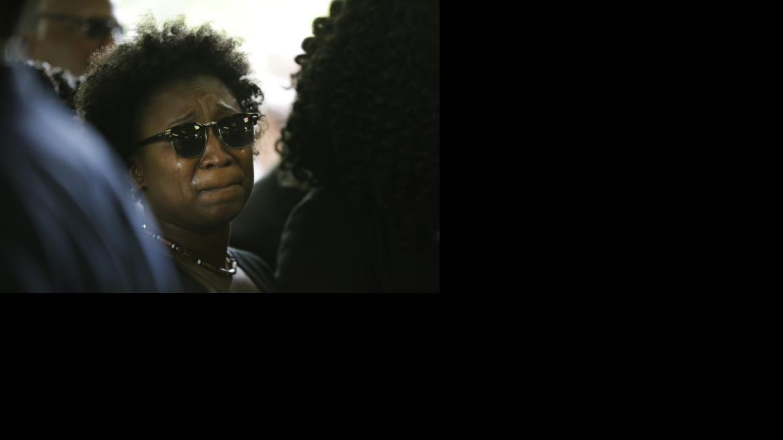 
A family member weeps while entering the W.O.R.D. Ministries Christian Center for the funeral of Walter Scott, Saturday, April 11, 2015, in Summerville, S.C. Scott was killed by a North Charleston police officer after a traffic Saturday, April 4, 2015. The officer, Michael Thomas Slager, has been charged with murder.

