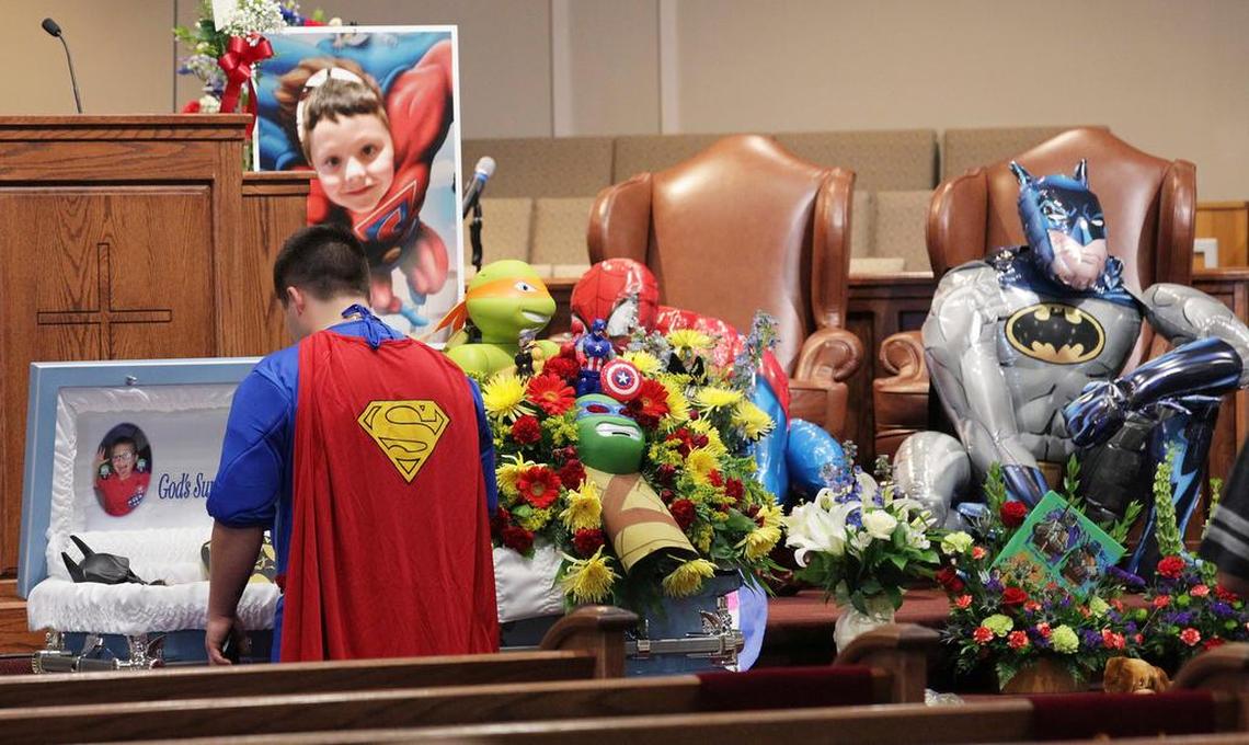 FILE-In this Wednesday, Oct. 5, 2016 file photo, Dale Hall, dressed as Superman, stands before the casket during a superhero-themed funeral service for his brother, Jacob Hall at Oakdale Baptist Church, in Townville, S.C. The teenager who shot and killed a child on a South Carolina school yard cried and apologized afterward and said it was a good thing his gun jammed before he could shoot more children, a detective testified Monday, Feb. 12, 2018.