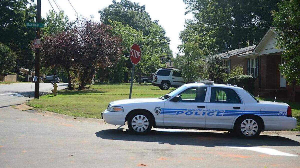 
Police remain in a neighborhood in southwest Charlotte Sunday, Sept. 6, 2015. A 7-year-old boy died after being shot during a party at the home on Fieldvale Place. 
