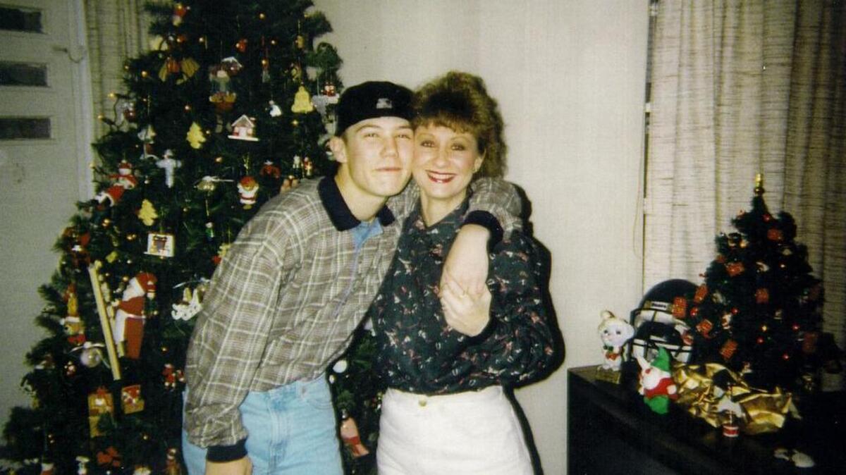 
Brandon Vinson with his mother, Donna, on Christmas Day 1994, six months before he was found stabbed to death in an old chicken coop at an abandoned farm off U.S. 1 near Gilbert.
