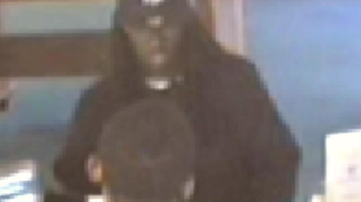 Authorities are seeking the public’s help in identifying the man pictured in this screenshot captured from video surveillance. He is accused of robbing First Palmetto Bank.