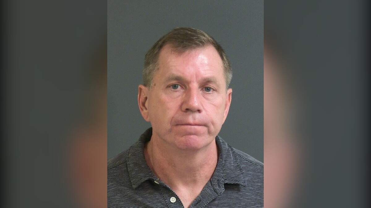 Kenneth Boes, a staff member at The Citadel, surrendered to state agents Wednesday on charges of criminal sexual conduct and providing beer or alcohol to persons under 21, officials said.