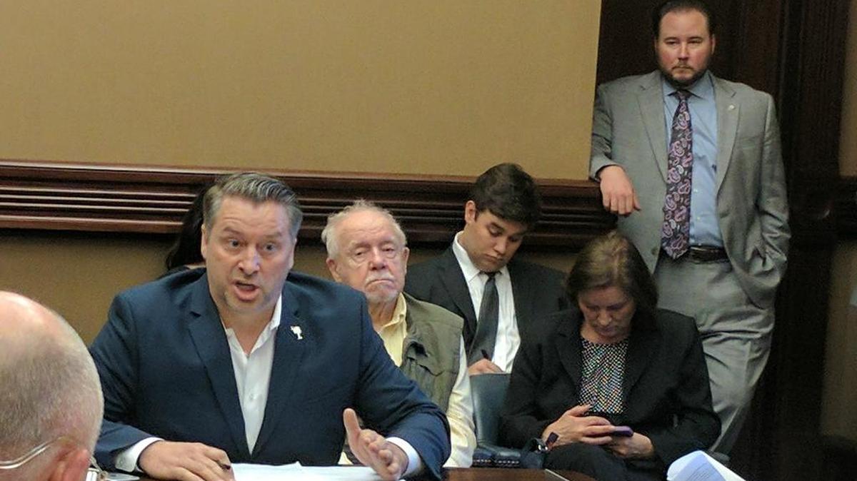 Paton Blough addresses state senators while advocating for requiring additional training in mental health for law enforcement officers.