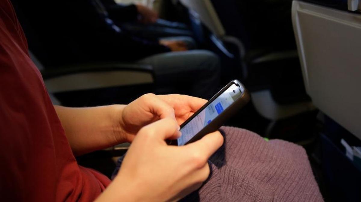 A woman was taken to a hospital after a fight with another woman who had used her cellphone during a movie at a Columbia, SC, theater, according to police.
