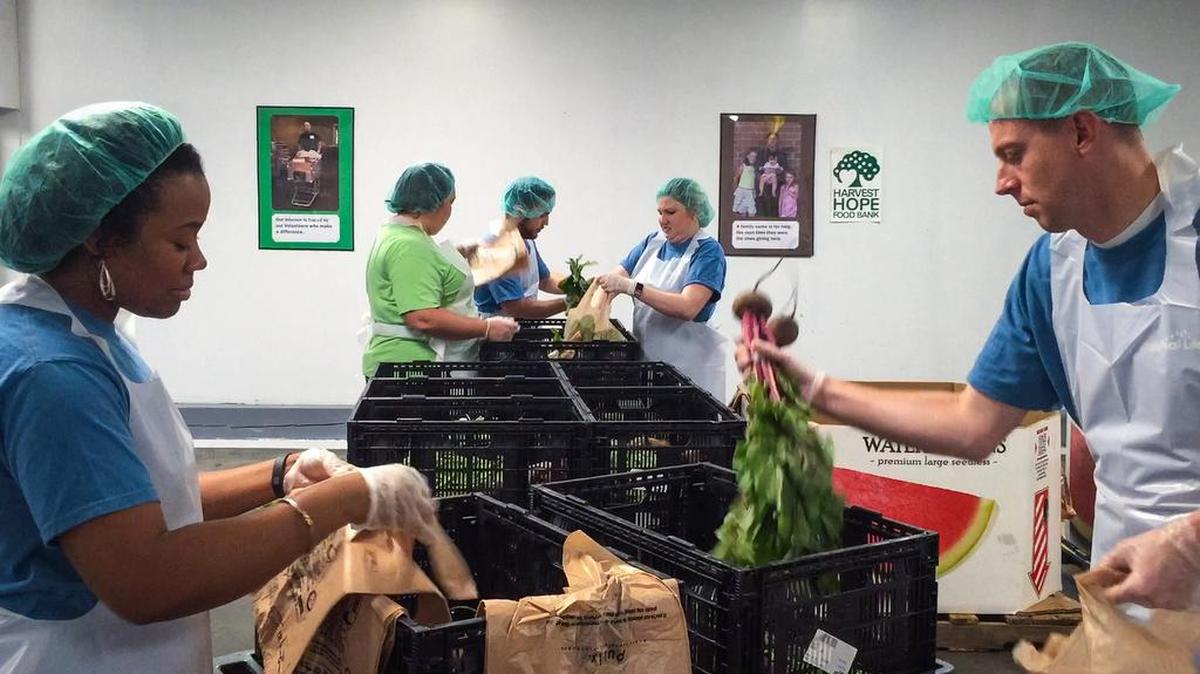Harvest Hope Food Bank closed Monday because of Hurricane Irma, but plans to reopen Tuesday an hour later than usual. Here, volunteers at the Shop Road location south of Columbia packed bags with food for hungry clients of the food bank.