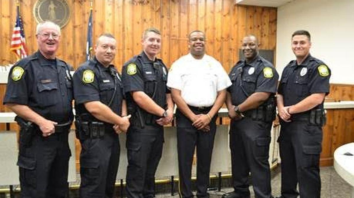 
Deputy Chief Melron Kelly (white shirt) stands with five new Columbia police officers who will undergo the Beyond the Badge program. 
