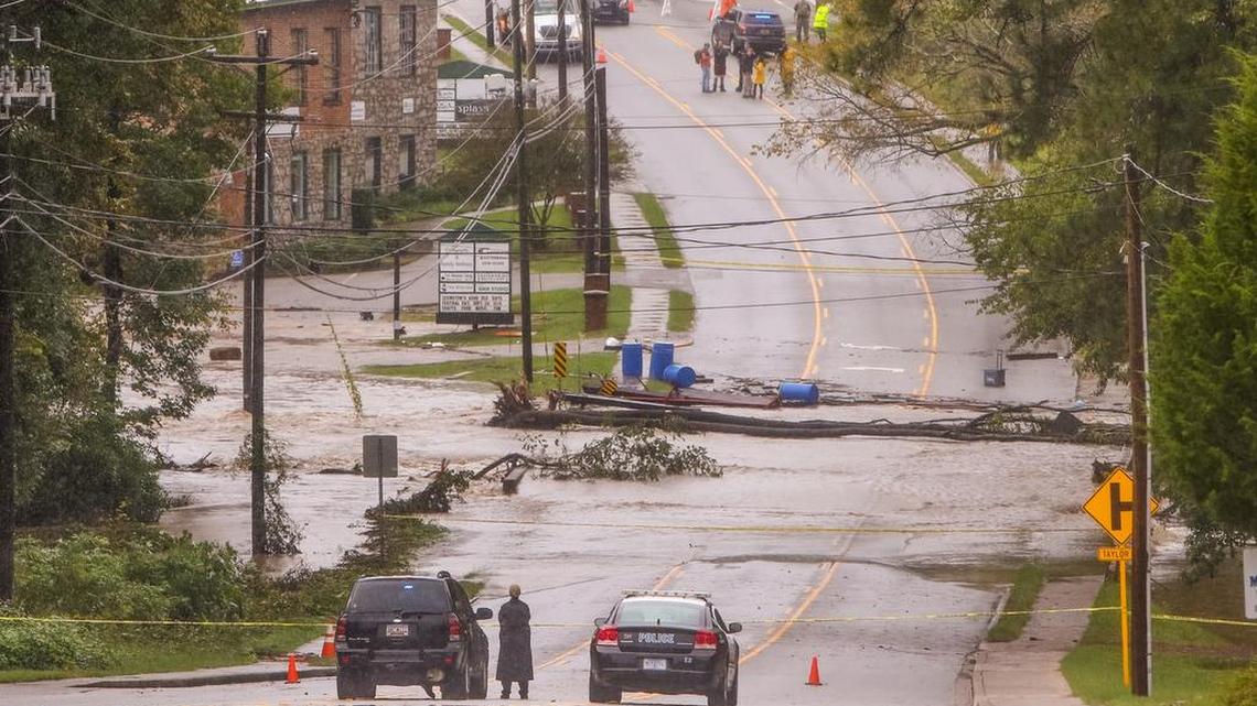 
A portion of Main street in Lexington was closed off after flood waters in Twelvemile Creek broke through the Old Mill dam in Lexington. 
