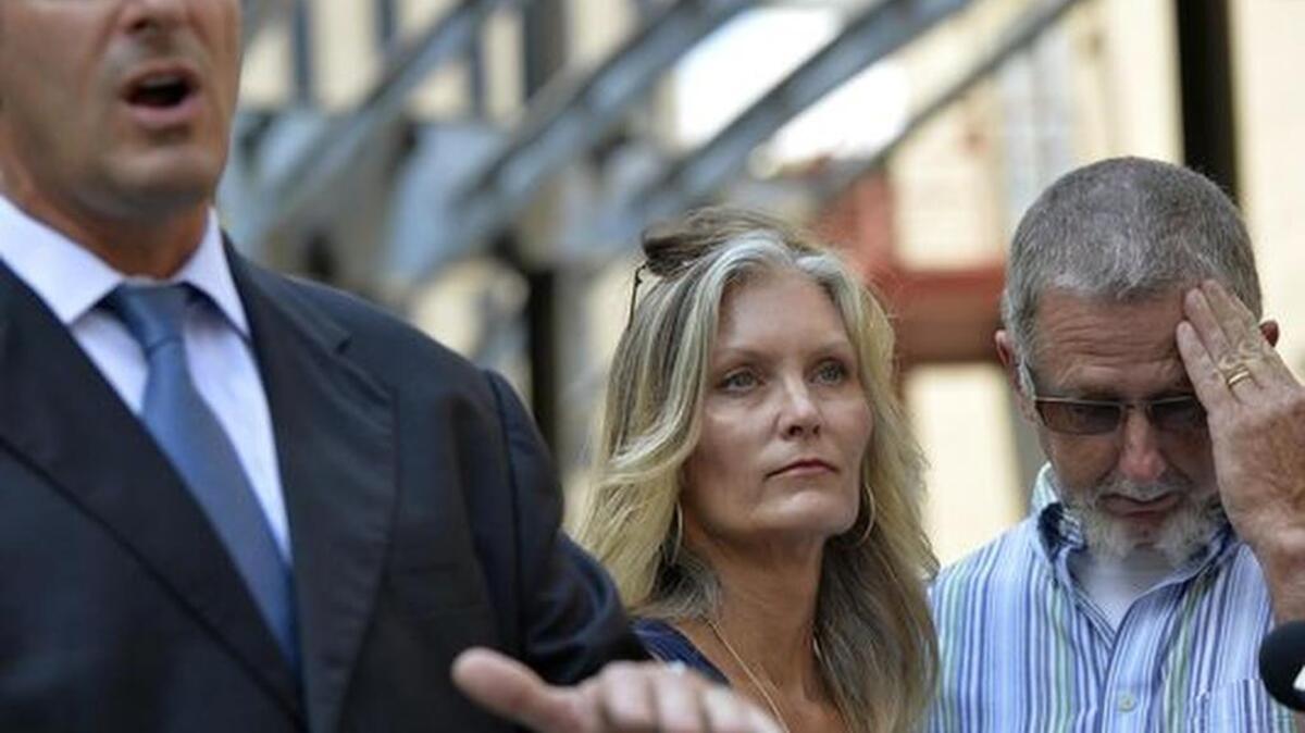 
Angie and Paul Hammond, parents of Zachary Hammond, pictured with attorney Eric Bland, speak during a recent press conference.
