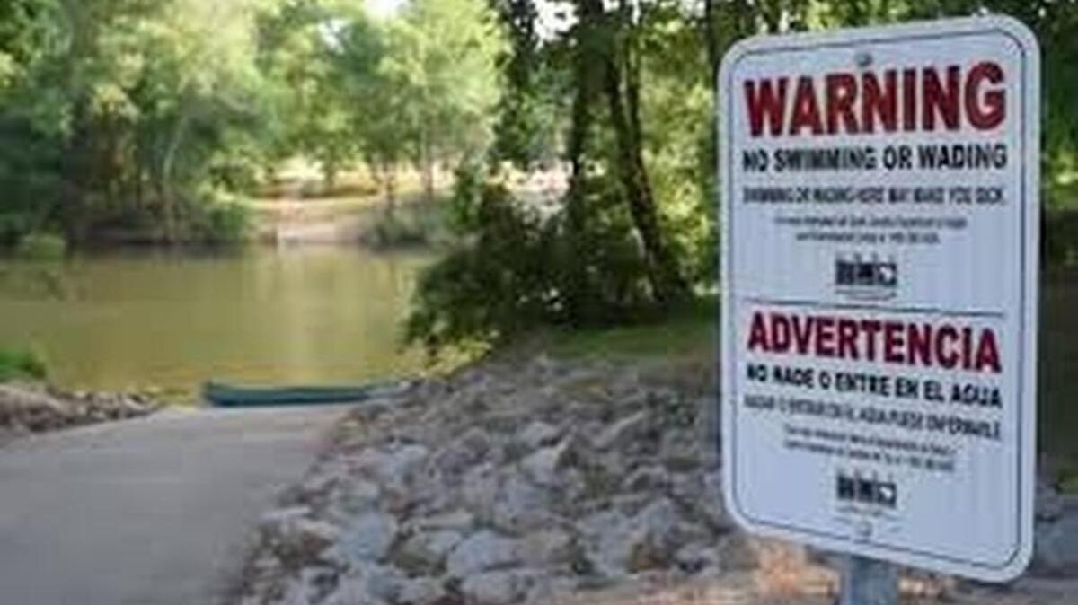 Signs advising against swimming and wading were posted in the Saluda River last week because of sewage that drained into the waterway from a malfunctioning wastewater plant