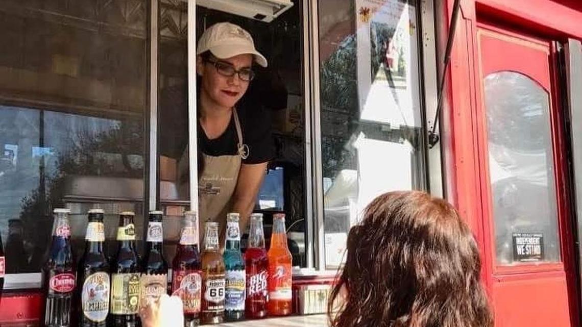 Teresa Stone serves a customer from The Blended Bakery trolley.