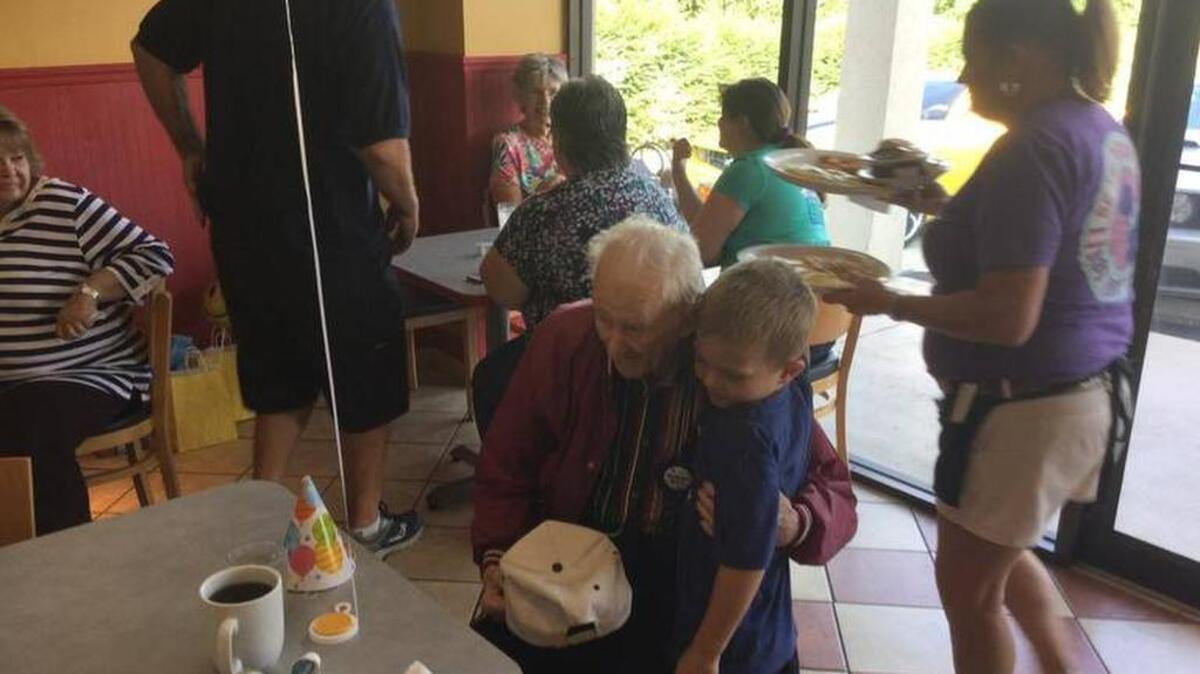 Sgt. Eldon Beaver, left, turned 100 years old Thursday. He spent four years in the military during World War II, much of it in combat aboard a B-17 bomber as a tail gunner. He was honored on his birthday for his service to his country, and for the service of all military during that time.