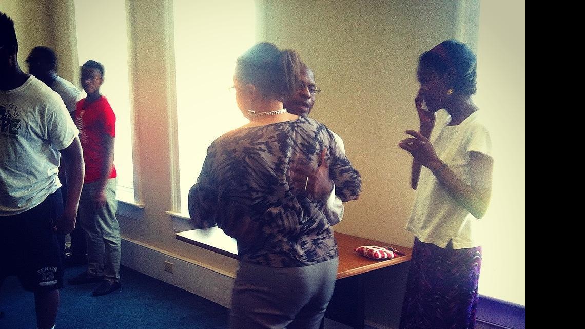 
The Rev. E. Robert Thomas, center, pastor of of Spring Hill A.M.E. Church and an Allen faculty member, hugs a participant at Thursday morning’s tribute.
