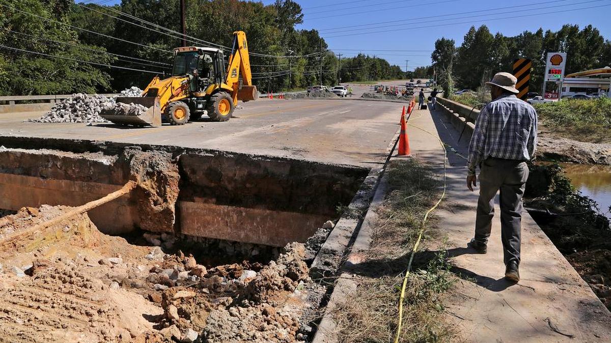 (October 14, 2015) Crews work on a section of Monticello Road near Interstate 20 that was washed out by flood waters.