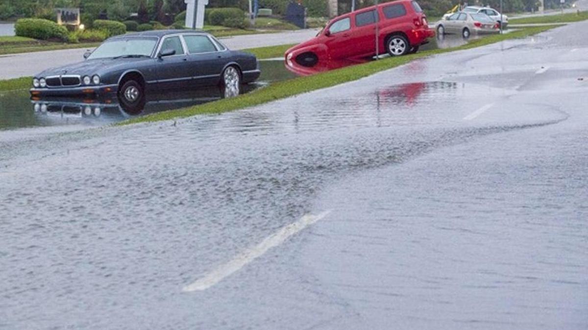 
Flood waters have receded temporarily leaving cars in the wake on Ocean Blvd in North Myrtle Beach.
