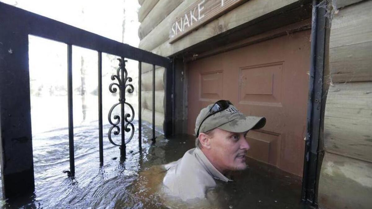 Frank Oliver enters the Wildlife Action center to turn off the power in the Fork Retch Community October 11, 2016. Hurricane Matthew left homes beneath 17 feet of water in the Pee Dee region, particularly in the towns of Mullins and Nichols.