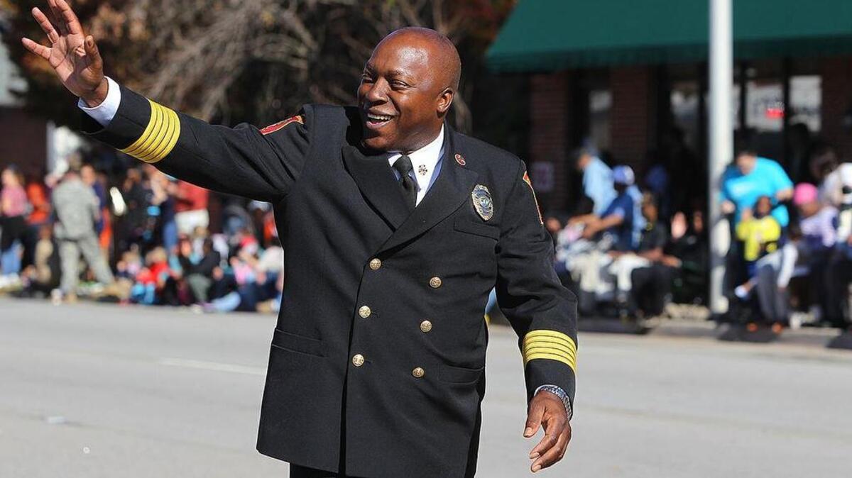Columbia Fire Chief Aubrey Jenkins waves at parade goers on Veterans Day in 2014.