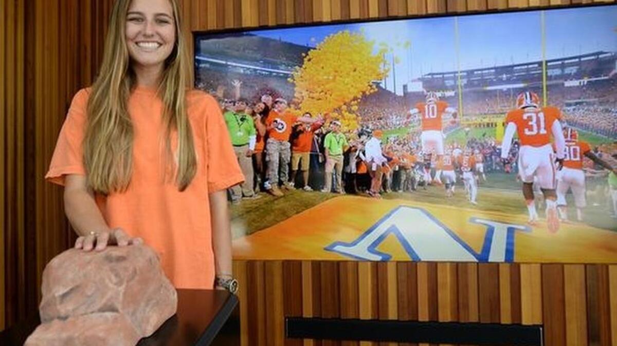 
Jessie Johnson, site manager for Experience Clemson, touches a replica of Howard’s Rock at the university’s new visitors center in downtown Greenville.
