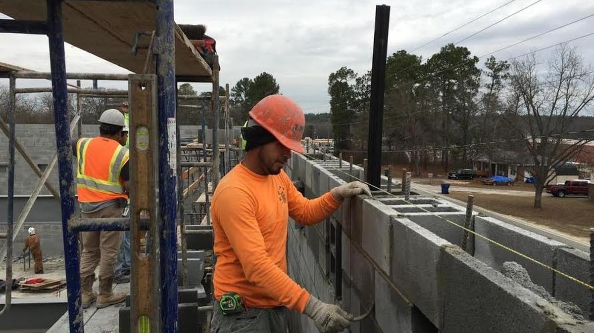 Brick layer Belmoro Martinez works on an addition to Congaree Elementary School in South Congaree. The project is to be finished in late spring.