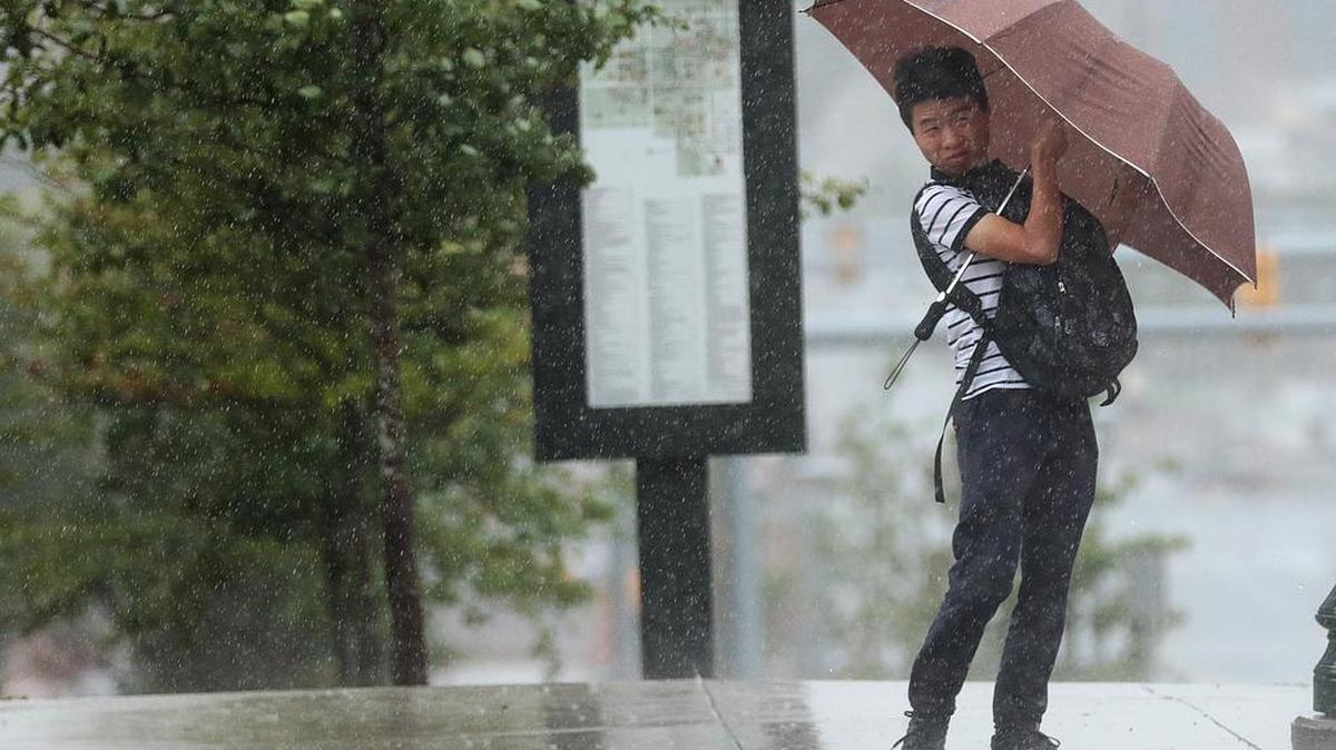 FILE: A USC student fights the rain and the wind on Assembly Street as Tropical Storm Hermine passes through Columbia on Friday afternoon.