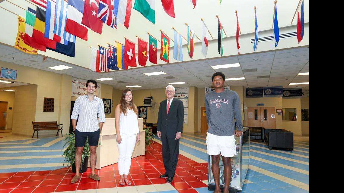 
A.C. Flora High School 2015 graduates Anil Kircaliali, left, Annie Williams, and Tyler Gray, along with Principal Richard McClure.


