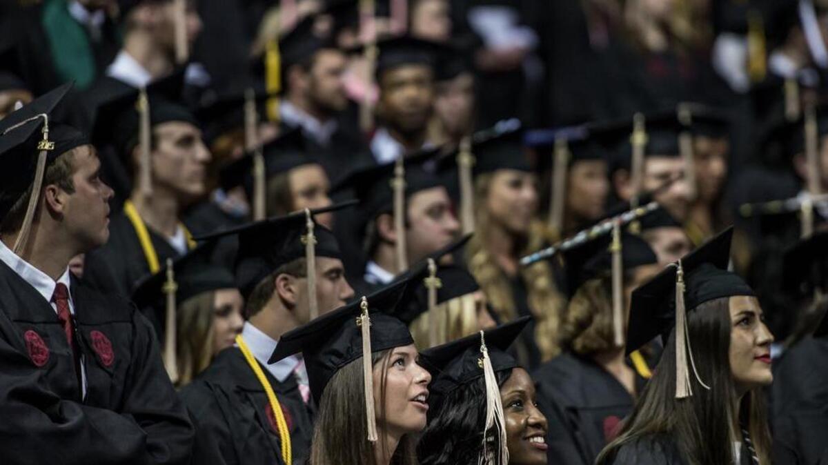 University of South Carolina graduates watch commencement ceremonies at Colonial Life Arena in May.