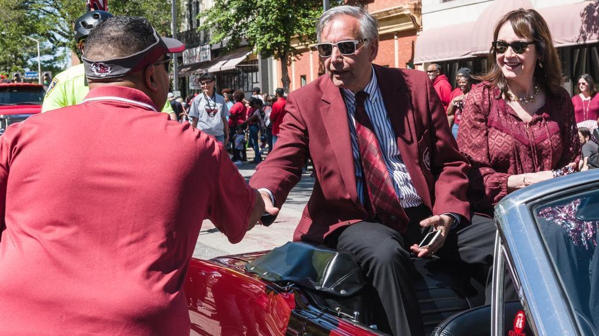 FILE: A fan shakes the hand of USC president Harris Pastides during a Columbia parade held to celebrate the national championship in women’s basketball.