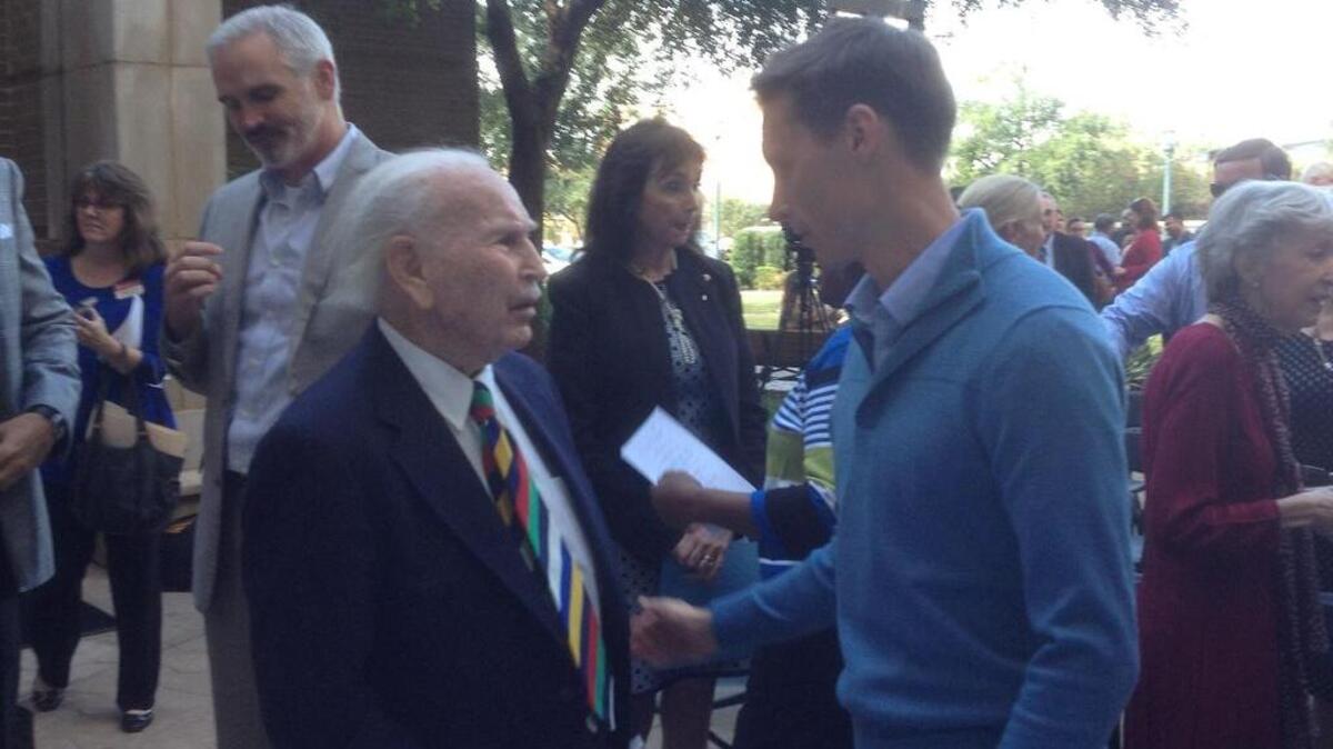 Philanthropist Norman Arnold talks with University of South Carolina professor Michael Beets following announcement of Arnold’s $7 million donation for health research.