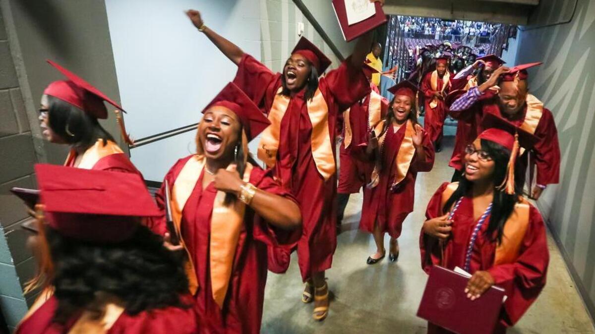Columbia High School graduates celebrate after graduation ceremonies Wednesday. Columbia was the first Midlands public school to graduate students this spring.