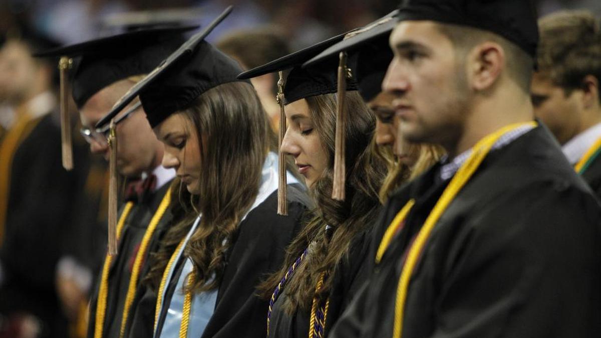 FILE: University of South Carolina students took part in the school's graduation ceremony inside Colonial Life Arena, Friday, May 6, 2016.