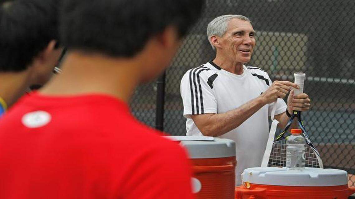 
Hammond High School tennis coach Bernie McGuire gives a life lesson to the team before practice, Thursday, March 26, 2015. McGuire has been named the Professional Tennis Registry High School coach of the year. 
