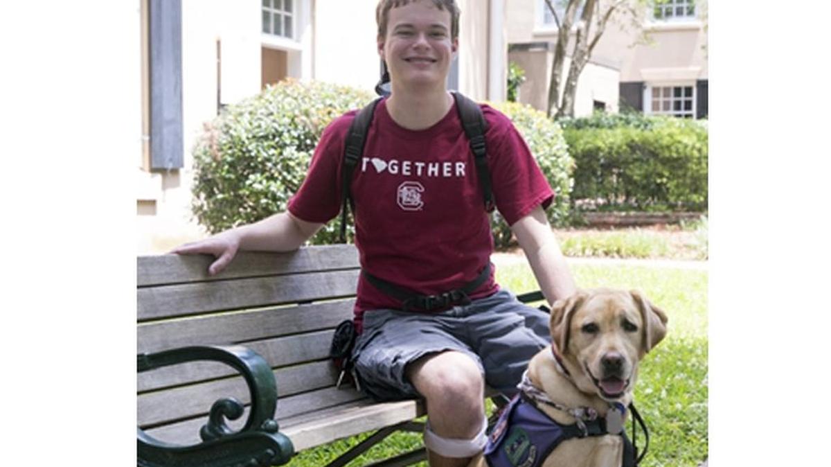 U of SC senior Jory Fleming and his guide dog Daisy.