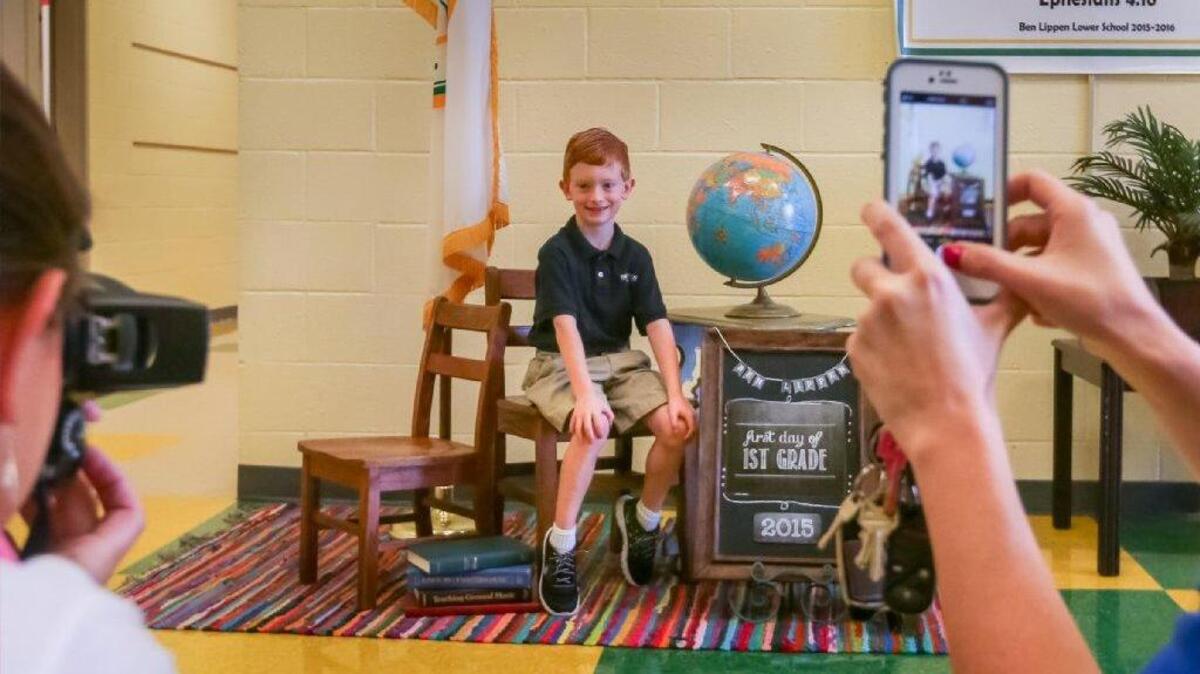 
First grader Noah Barker poses for his first day photo Wednesday at Ben Lippen, the first school in the Midlands to resume classes.
