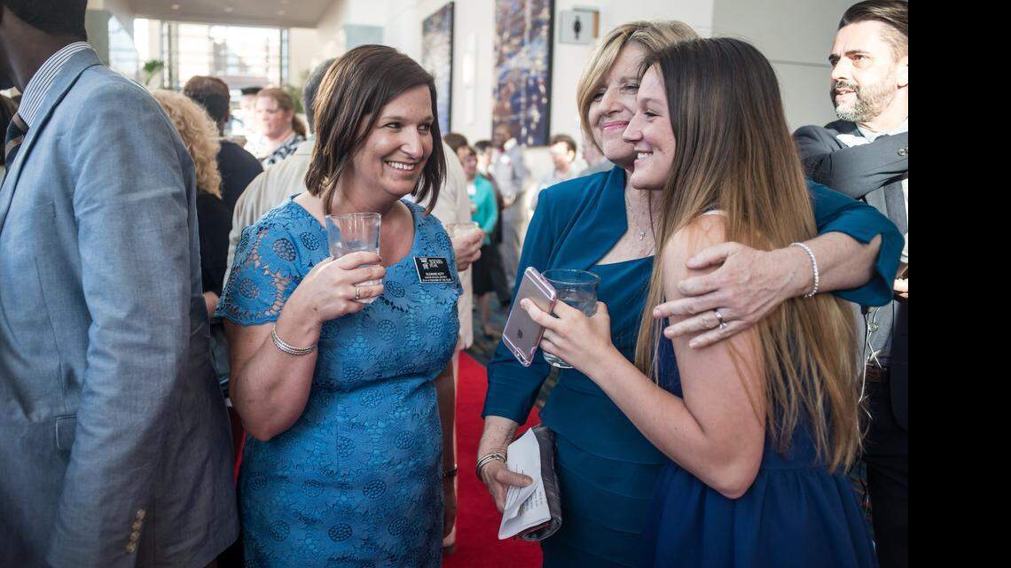 
Suzanne Koty, left, socializes with her daughter Mary Koty and S.C. State Superintendent Molly Spearman, center, Wednesday night at the Columbia Metropolitan Convention Center. Koty was named South Carolina’s teacher of the year.
