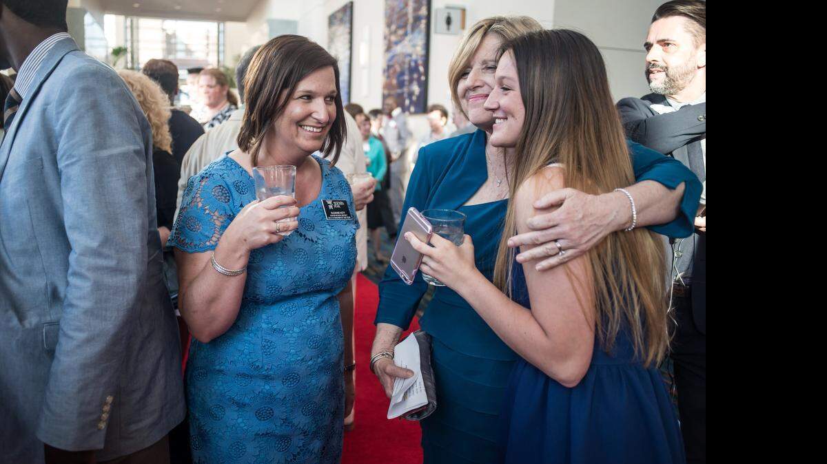 
Suzanne Koty, left, socializes with her daughter Mary Koty and S.C. State Superintendent Molly Spearman, center, Wednesday night at the Columbia Metropolitan Convention Center. Koty was named South Carolina’s teacher of the year.
