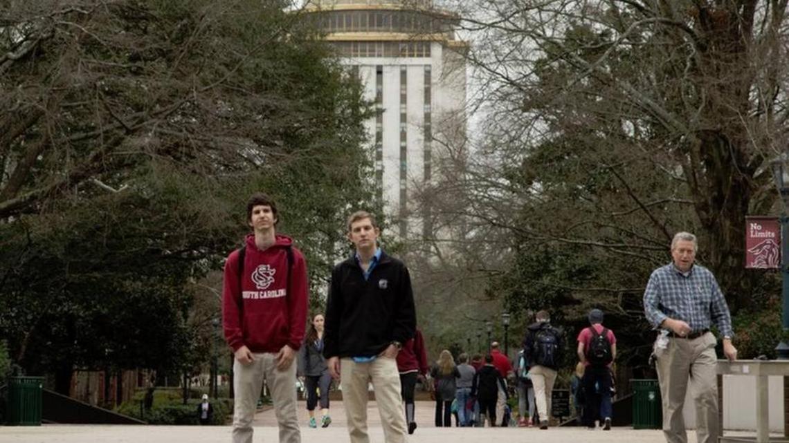 Ross Abbott, right, and Michael Kriete are University of South Carolina students who had to explain their decision to show posters that questioned freedom of speech limits at public universities. Abbott on Tuesday sued USC even though it did not follow through with threatened disciplinary action after some students complained about the posters.