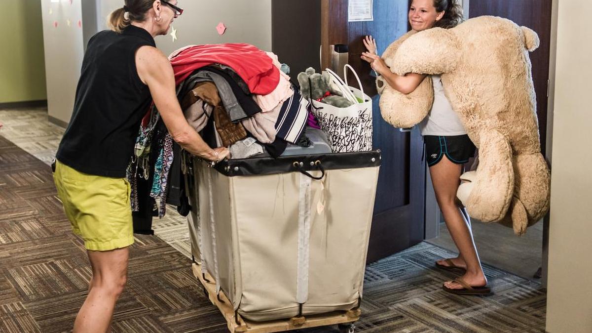 
Sarah Murillo helps her daughter Laura move into to her new dorm room Wednesday morning at Patterson Hall. University of South Carolina students with plans to participate in sorority rush activities returned to campus while the remaining are expected to return on Saturday. Classes begin August 21. 
